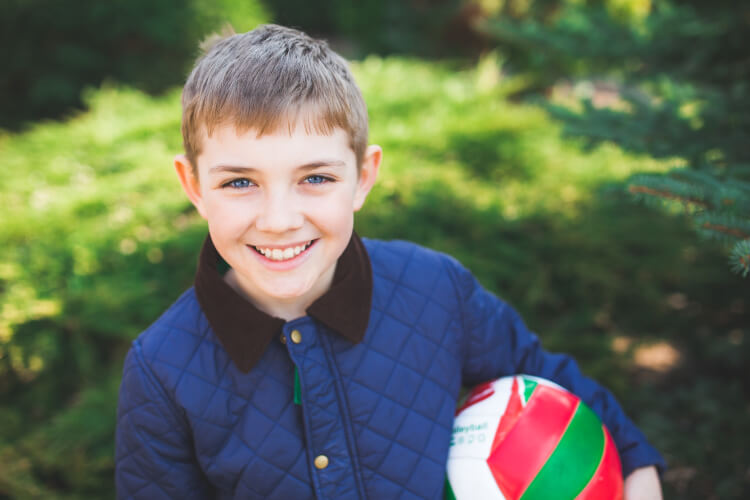 Young boy playing with ball