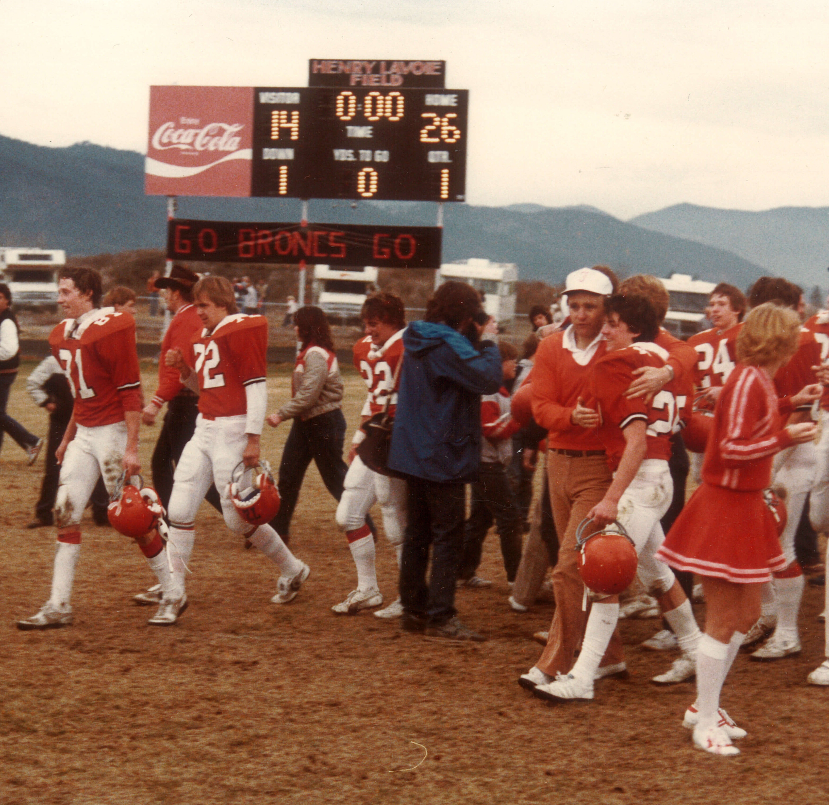 Coach Rick Unruh with the Broncs after the '83 State Championship game.
